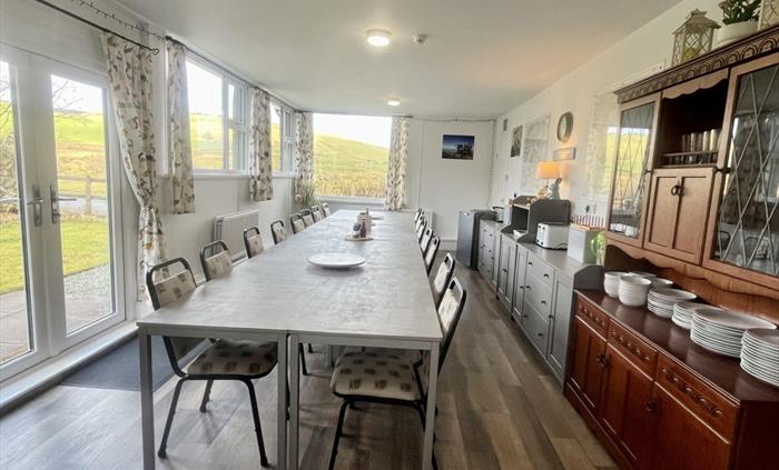 Our large bright dining room has amazing views across the valley.